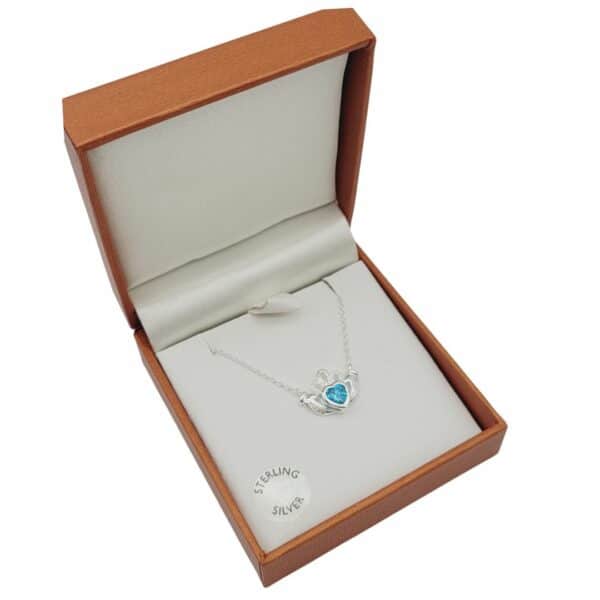 Sky Blue Claddagh Pendant. Handcrafted in Ireland with Sterling Silver and presented on an 18" chain. Boxed. Special Event Piece.