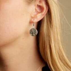 Delicately handcrafted from Connemara marble, these earrings boast an intricate tree of life pattern which has been rendered from Irish sterling silver. 