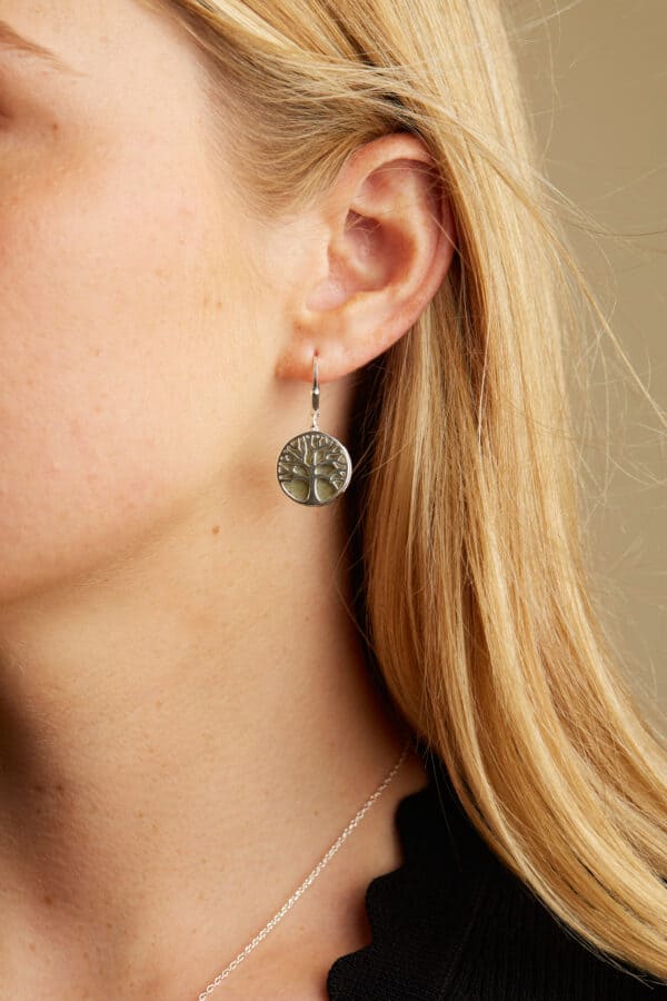 Delicately handcrafted from Connemara marble, these earrings boast an intricate tree of life pattern which has been rendered from Irish sterling silver. 