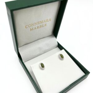 Our silver Connemara marble stud earrings feature natural green Connemara marble at the center, making each pair one of a kind. Handcrafted in Ireland.