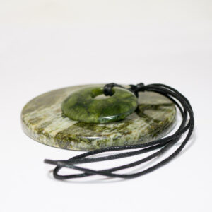 Green Connemara Marble Oval Luck Stone Pendant with fully adjustable black cord. Natural and unique Celtic Jewelry hand crafted in Ireland.