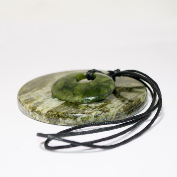 Green Connemara Marble Oval Luck Stone Pendant with fully adjustable black cord. Natural and unique Celtic Jewelry hand crafted in Ireland.