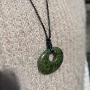 Green Connemara Marble Oval Luck Stone Pendant with fully adjustable black cord. Natural and unique Celtic Jewelry hand crafted in Ireland.