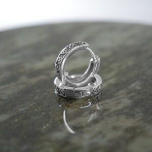 Trinity Knot sterling silver, huggie style earrings. Hand crafted in Ireland with hallmarked 925 silver designed for a comfortable and secure fit.