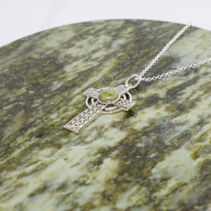 Connemara Marble Silver Celtic Cross pendant hand crafted in Ireland with our authentic natural gemstone and hallmarked Irish silver. 18" Chain included.