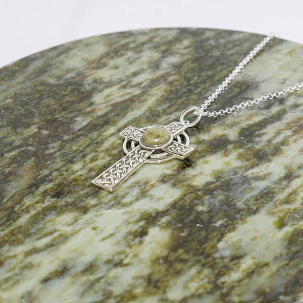 Connemara Marble Silver Celtic Cross pendant hand crafted in Ireland with our authentic natural gemstone and hallmarked Irish silver. 18" Chain included.