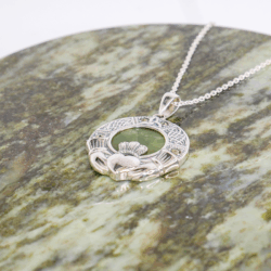 Sterling silver with Marcasite gemstone Irish Claddagh pendant. Hand crafted in Ireland with genuine, green Connemara Marble and hallmarked silver.