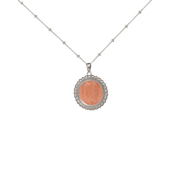 Lucky Irish coin sterling silver pendant. Hand crafted in Ireland with a genuine 1p coin minted between 1973 - 2002. Presented on an 18" silver chain.