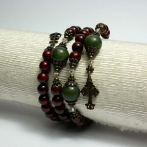 Cinnamon red with green Connemara Marble beads this coil bracelet combines natural beauty with spiritual strength. Faith, Hope, Charity.