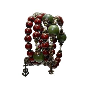 Cinnamon red with green Connemara Marble beads this coil bracelet combines natural beauty with spiritual strength. Faith, Hope, Charity.