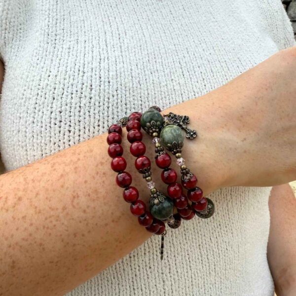 Cinnamon red with green Connemara Marble beads this coil bracelet combines natural beauty with spiritual strength. Faith, Hope, Charity.