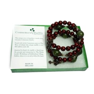 Cinnamon red with green Connemara Marble beads this coil bracelet combines natural beauty with spiritual strength. Faith, Hope, Charity.