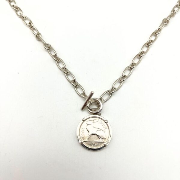 Silver Irish thrupenny coin necklace with T-bar clasp. Hand crafted in Ireland featuring the classic hare design on a genuine collectible Irish coin pendant.