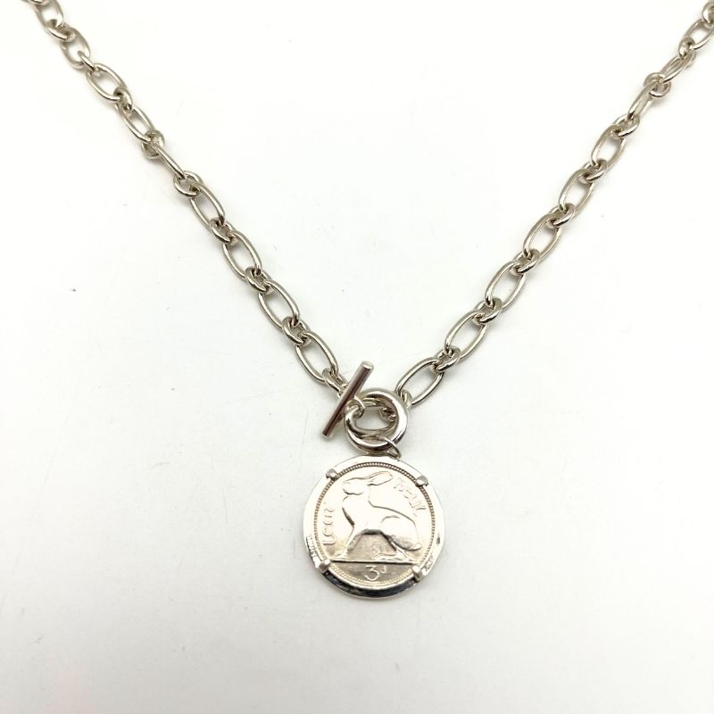 Silver Irish thrupenny coin necklace with T-bar clasp. Hand crafted in Ireland featuring the classic hare design on a genuine collectible Irish coin pendant.