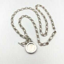 Silver Irish thrupenny coin necklace with T-bar clasp. Hand crafted in Ireland featuring the classic hare design on a genuine collectible Irish coin pendant.