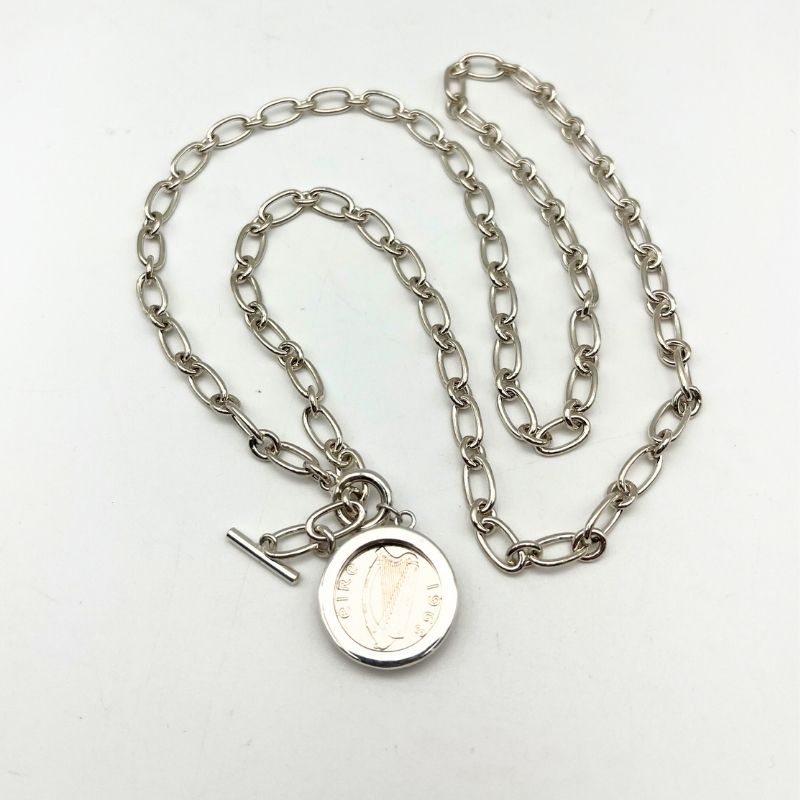 Silver Irish thrupenny coin necklace with T-bar clasp. Hand crafted in Ireland featuring the classic hare design on a genuine collectible Irish coin pendant.