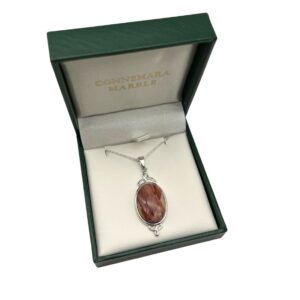 Hallmarked sterling silver Trinity Knot pendant, featuring a cameo-style sandstone gemstone center. Handcrafted in Ireland and elegantly gift boxed.
