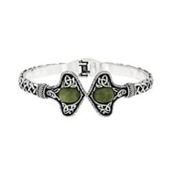 Silver tone Connemara Marble torc-style cuff bracelet with Celtic knot detailing. Unisex Irish design with hinged fit, timeless and meaningful.