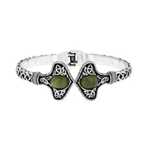 Silver tone Connemara Marble torc-style cuff bracelet with Celtic knot detailing. Unisex Irish design with hinged fit, timeless and meaningful.