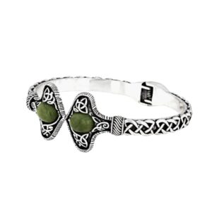 Silver tone Connemara Marble torc-style cuff bracelet with Celtic knot detailing. Unisex Irish design with hinged fit, timeless and meaningful.