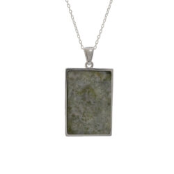 Connemara marble Celtic wave pendant in sterling silver, made in Ireland. A timeless Irish jewelry gift inspired by ocean symbolism and Celtic design.