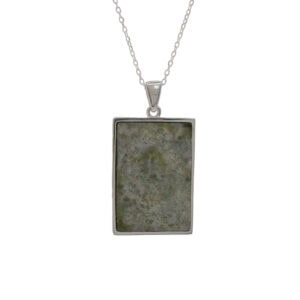 Connemara marble Celtic wave pendant in sterling silver, made in Ireland. A timeless Irish jewelry gift inspired by ocean symbolism and Celtic design.