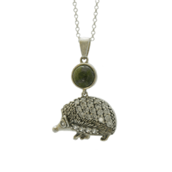 Sterling silver hedgehog necklace made in Ireland with genuine Connemara marble gemstone. A charming Irish jewelry gift inspired by nature.