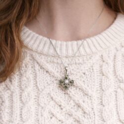 Hand crafted in Ireland our silver Celtic Cross pendant features natural Connemara Marble and Mother of Pearl. Real living history, deeply symbolic.
