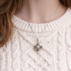 Hand crafted in Ireland our silver Celtic Cross pendant features natural Connemara Marble and Mother of Pearl. Real living history, deeply symbolic.
