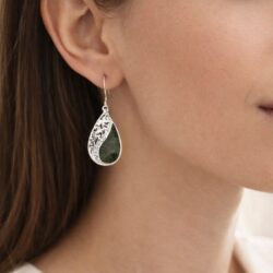 Sterling silver Connemara marble shamrock drop earrings. Authentic Irish jewelry featuring natural green Connemara marble and delicate shamrock design.