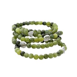 Genuine Connemara marble 5-piece stretch bracelet set with Celtic knot and heart details. Includes pouch and certificate of authenticity. Made in Ireland.