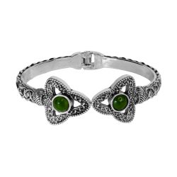 Inspired by the Trinity Knot, this striking Cuff Bracelet symbolizes never ending love. Hand crafted in Ireland with Connemara Marble gemstone.